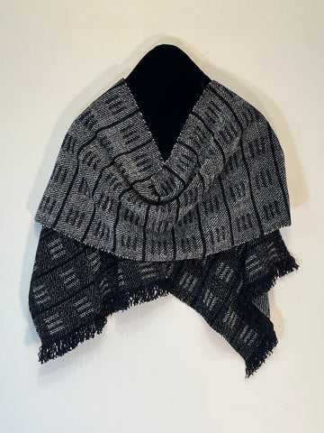 Black and gray scarf made from chenille yarn.